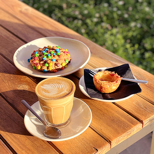 Banksy Loaded Cookie, Portuguese Tart, and latte